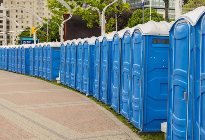 a clean row of portable restrooms for outdoor weddings or festivals in Atlas